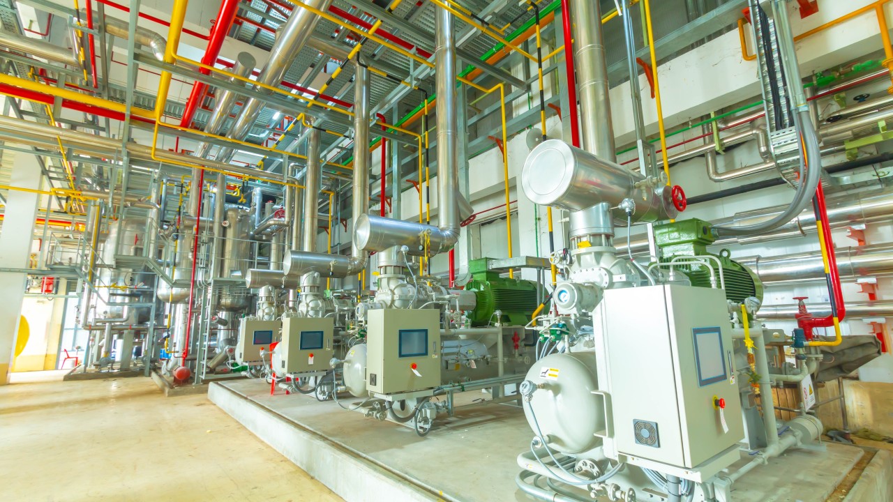 Building automation technician inspecting HVAC controls