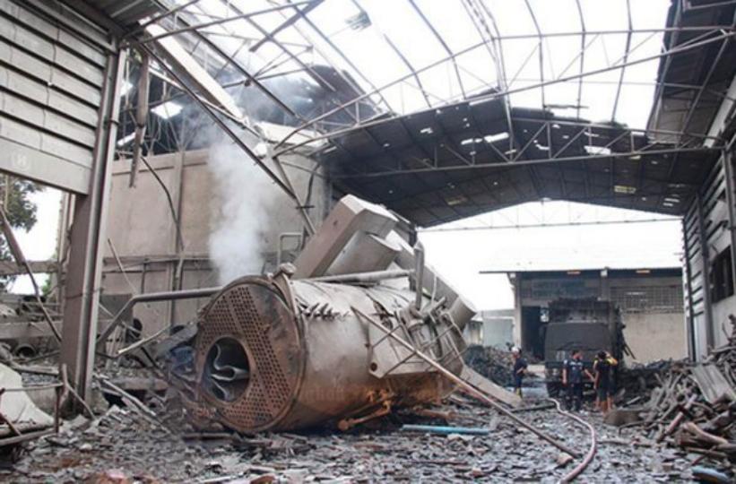 Technician inspecting boiler controls