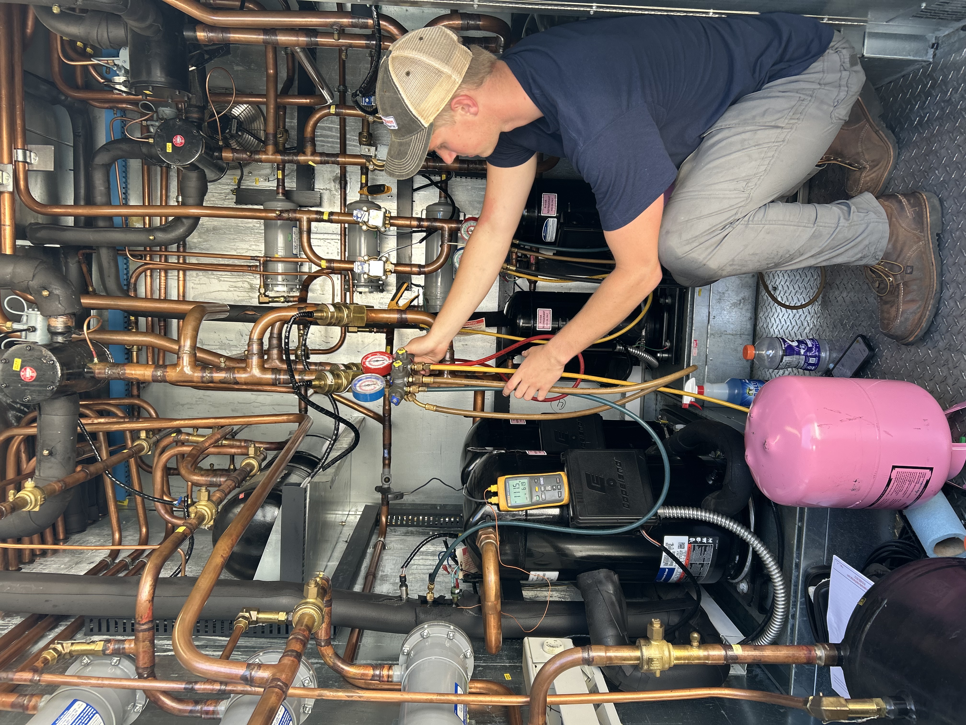 Commercial HVAC maintenance on rooftop unit
